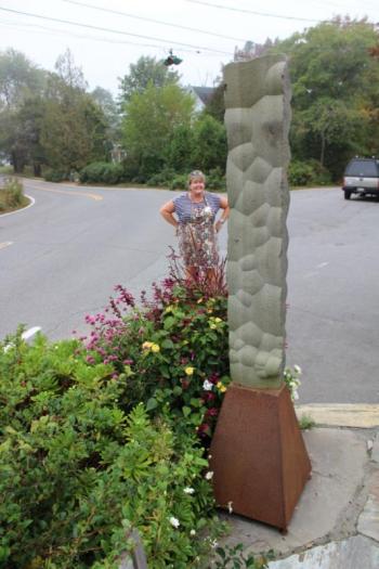 East Boothbay General Store owner Liz Evans admires the sculpture by New York artist Chris Lewis. Sophie West photo