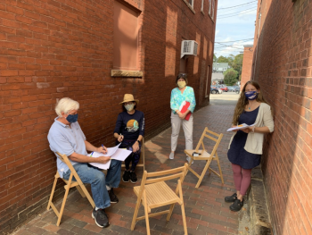 The closing of the Burr property in September. Pictured from left are John and Karen Burr, KELT’s Executive Director Carrie Kinne and lawyer Jenny Burch. Courtesy of KELT