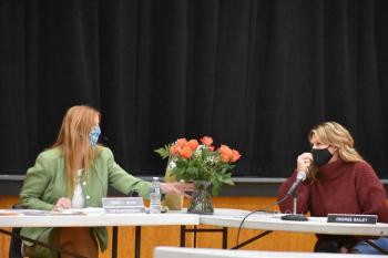 Wiscasset Superintendent of Schools Terry Wood receives flowers from committee member Desiree Bailey. SARAH WHITFIELD/Wiscasset Newspaper