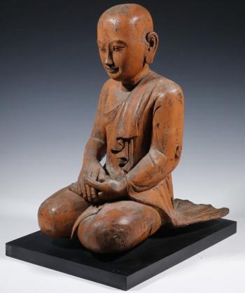 18th century Burmese Buddhist temple carved wooden kneeling disciple figure. Courtesy of Thomaston Place