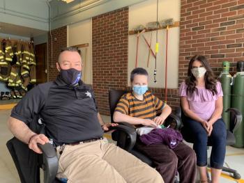 From left, Lincoln County Sheriff’s Detective Scott Hayden, daughter Eva, 12, and Wiscasset Police Department Administrative Assistant Stephany Blodgett mind the bins during Prescription Drug Take Back Day at Wiscasset’s public safety building April 24. SUSAN JOHNS/Wiscasset Newspaper
