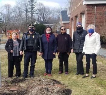 Attending the flag-raising ceremony are, from left, Sara Fahnley, Chief Larry Hesseltine, Audrey Miller, Vivian Waltz, Clara Wentworth and Susann Hochstein. Bruce Hutchins photo