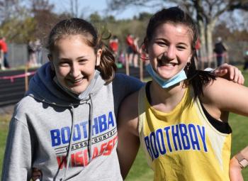 Seahawks Grace Campbell, left, and Ava Schlosser before the start of the May 6 track meet Wiscasset hosted. PHIL DI VECE/Wiscasset Newspaper