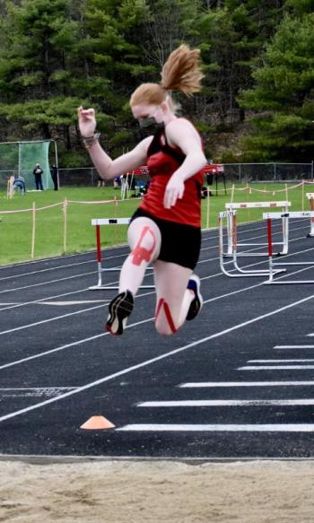 Sadie Yeaton long jumps. PHIL DI VECE/Wiscasset Newspaper