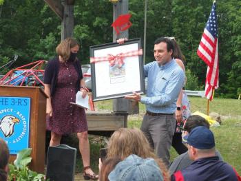 Former Edgecomb School Committee chairman Tom Abello receives a certificate of appreciation June 14 during the sixth grade graduation ceremony. BILL PEARSON/Boothbay Register