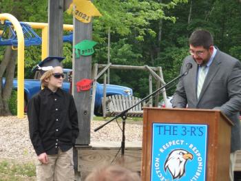 Principal Ira Michaud congratulates sixth grade graduate Jayden Orne June 14 at Edgecomb Eddy School. BILL PEARSON/Boothbay Register