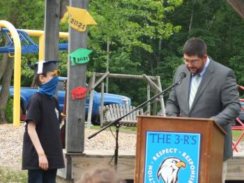 Principal Ira Michaud congratulates sixth grade graduate Mathew Scarborough June 14. BILL PEARSON/Boothbay Register