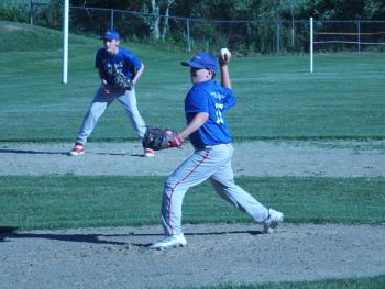 Midcoast pitcher Leslie White Jr. fires a pitch against Brunswick in the District 4 Cal Ripken Youth Baseball tournament held in Boothbay Harbor June 14 -18. BILL PEARSON/Boothbay Register