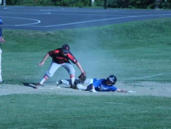 Midcoast slugger David Frazee tries turning a double into a triple June 16 against Brunswick, but was thrown out at third base. BILL PEARSON/Boothbay Register