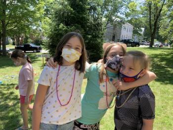 From left, Evie Herrick, 10, and Clover Apczynski, 9, and brother Bodhi, 7, enjoy Summerfest on the Wiscasset common July 24. Herrick’s sister Alex, 9, background left, said the crafts were her favorite part of Summerfest. SUSAN JOHNS/Wiscasset Newspaper