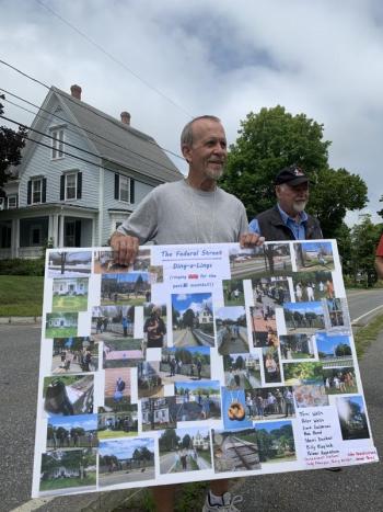 Peter Wells holds a poster of group memories. At right, Bob Bond. SUSAN JOHNS/Wiscasset Newspaper