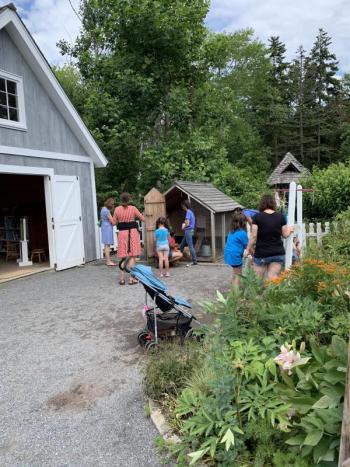 Chicken feeding by the Story Barn, carried out by volunteer youth education steward Zoe Curtis. LILLY CURTIS/Boothbay Register