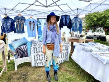 Boothbay native Morgan Mitchell shows off handpainted shirts and jackets at the 59th Windjammer Days’ Artists’ Alley. ISABELLE CURTIS//Boothbay Register