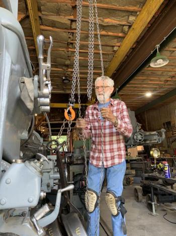 Jerry Steinke cleans wheels July 31. SUSAN JOHNS/Wiscasset Newspaper