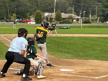 Owen Cotta from Alna strikes the ball to left field during a Lincoln Babe Ruth game against Topsham. Courtesy of Shanon Cotta