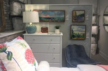 Three Henry Isaacs paintings adorn this single bedroom – another example of groupings of paintings. LISA KRISTOFF/Boothbay Register COVE by Knickerbocker Group