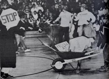 Wiscasset High School hosted a donkey basketball game in March 1985. On the right behind the wheelbarrow is former athletic director and phys ed teacher Eugene Stover. He volunteered to be part of the cleanup crew. That’s Bob MacDonald holding the basketball and Lloyd Savage, both members of Wiscasset Fire Department’s team. Phil Di Vece photo