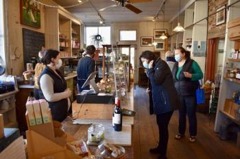 Treats manager Cassie Reed waiting on Francie Siegfried, owner of Birch. PHIL DI VECE/Wiscasset Newspaper