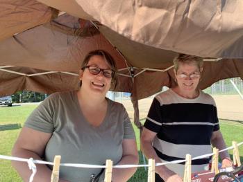 Lucy Oyster-Ackerman and her mother Bette Oyster set up a treats table at a cookout May 20 at Wiscasset’s community playground. SUSAN JOHNS/Wiscasset Newspaper