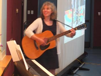 Music teacher Jennifer McIvor leads a group sing-a-long of the Edgecomb Eddy song. BILL PEARSON/Boothbay Register