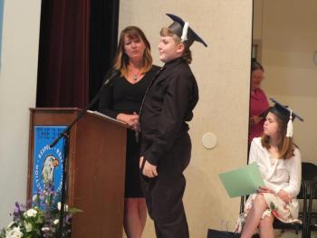 Guidance Counselor Haley Bezon presents Marshall Carpenter with a certificate recognizing his best personal trait, helpfulness. BILL PEARSON/Boothbay Register