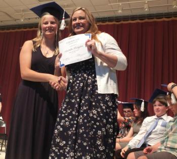 Arabella Hodgdon receives her sixth grade diploma from Principal Dr. Christina Boursaw. BILL PEARSON/Boothbay Register