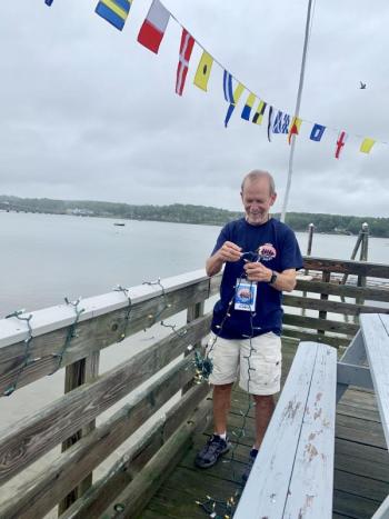 Schoonerfest Co-Admiral Peter Wells helps set up. SUSAN JOHNS/Wiscasset Newspaper