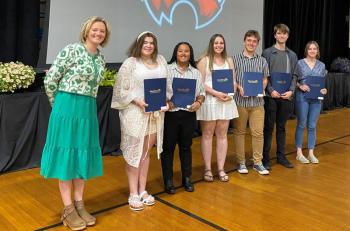 First National Bank employee Alyssa Allen stands with six of the nine 2022 WMHS seniors who received Worthington Scholarships in June. From left are Allen, D'Nisha Dawkins, Latisha Wright, Hailey Talbert, Dillon Leeman, Mason Davenport, Ruby Cossaboon. Missing were Maxx Syrjala, Reese Hesseltine and Evan Strong. Courtesy photo
