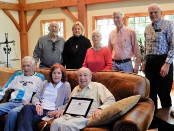 At the Westport Island home of Morton “Mort” and Patti Mendes, front middle and right, well-wishers pose after Mort, 96, was handed the Boston Post cane Sept. 24 as the town’s oldest resident. At far left front is retired first selectman George D. Richardson Jr. And back row, from left, are retired second selectman Jerry Bodmer; and Municipal Agent Dedee Greenleaf-Hodgdon, First Selectman Donna Curry, Chair and Second Selectman Jeff Tarbox; and family friend David Bertran. Gaye Wagner photo