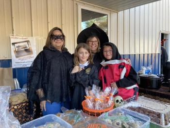 Jen Hanson left, works the bake sale with her niece, Hailey Hanson, board member Celeste Rouleau and volunteer Jeramy Plourde. EDNA MILLER/Wiscasset Newspaper Event