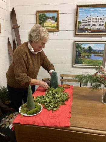 Mare LeMay builds a tabletop tree. EDNA MILLER/Wiscasset Newspaper