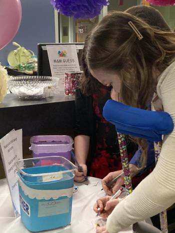 Riley Johnston fills out a raffle ticket. EDNA MILLER/Wiscasset Newspaper