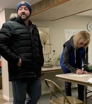Michael Maxim of Edgecomb waits as Barbara Brennan signs his nomination papers for selectman. Maxim is not running in the April 15 special election. He is running for a full term during the May municipal election. Maxim attended the March 7 select board meeting and budget hearing. BILL PEARSON/Boothbay Register
