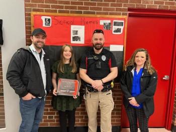 Wiscasset School Resource Officer Jonathan Barnes and Wiscasset Police Department’s latest “Outstanding Citizen,” WMHS sixth grader Isla Bickford, with Bickford’s mother KC Fairfield, far right, and father Tony Bickford, far left. Courtesy of Wiscasset Police Department