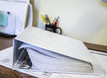An exhaustive manual of safety information, checklists, and training documentation sits on a desk at the Edgecomb Fire Department. The binder was compiled specifically for the Edgecomb department by consultant Lynn Martin. Bisi Cameron Yee photo manual