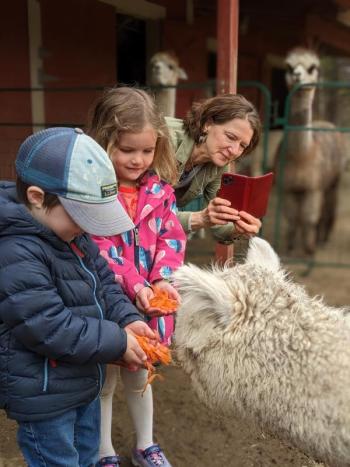 Students feed Theodora shredded carrots. CANDI JONETH/Boothbay Register