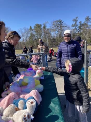Brunswick’s Ingrid Bishop, 7, turns in her ticket to Parks and Recreation Director Duane Goud in exchange for a stuffed bunny. EDNA MILLER/Wiscasset Newspaper