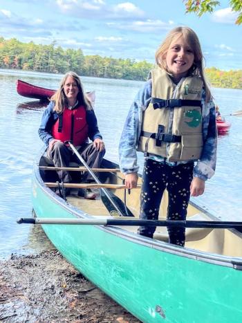 Lydia Crafts and daughter Kestrel canoe at Family Retreat. Courtesy of Hearty Roots