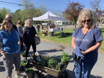 Shoppers Lauren Stockwell, left, and Cindy Gustafson line up to pay. SUSAN JOHNS/Wiscasset Newspaper