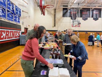 Alumni and guests line up to enjoy dinner by Midcoast Caterers. ISABELLE CURTIS/Wiscasset Newspaper