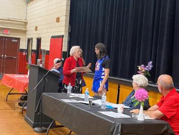 Class of 1950’s Janice Fogg presents a scholarship to graduating senior Bryan Gagnon. ISABELLE CURTIS/Wiscasset Newspaper