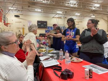 Bryan Gagnon, his mother Ashley Gagnon, Class 2002, grandmother Debbie Gagnon, Class of 1981, and grandfather David Gagnon, Class of 1977 applaud his great-grandmother Ann Quinnam Sparks, who also attended Wiscasset. ISABELLE CURTIS/Wiscasset Newspaper