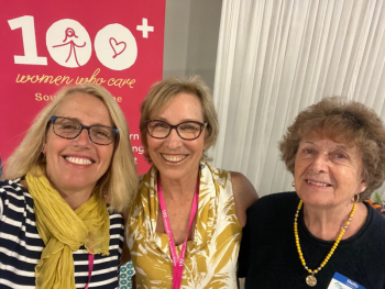 Deb Bergeron, center, founder of 100 Women Who Care Southern Maine, flanked by Patrisha McLean, left, and Mary Lou Smith. McLean is the founder/president of Finding Our Voices. Smith is one of 45 Maine survivors whose photo portraits are featured on the Finding Our Voices posters de-stigmatizing domestic abuse in 90 Maine towns. Photo by Patrisha McLean