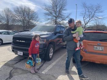 Wiscasset’s Zach Gray, daughter Zoey and son Zander head for the egg hunt. SUSAN JOHNS/Wiscasset Newspaper