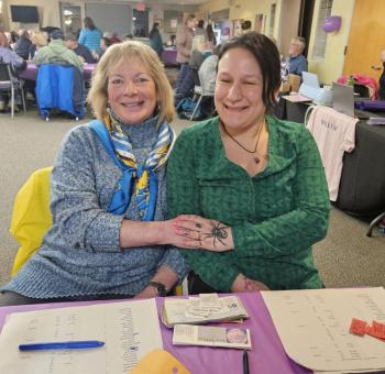 Canny Chan, left, and Chantel Nelson sell dinner tickets and accept donations at the Feb. 28 fundraiser in Wiscasset, in support of Willow Orr. Beth Bluteau photo