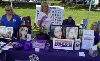 Parents who lost loved ones to overdose staff a resource table at a 2023 716 Candles International Overdose Awareness Day event in Damariscotta. Courtesy of Peter Bruun