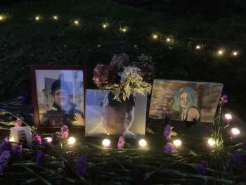 Lighted portraits of loved ones lost to substance use at the Wiscasset Sunken Garden, from the 716 Candles International Overdose Awareness Day project in 2023. Courtey of Peter Bruun