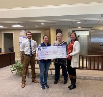 Pictured from left are: First National Bank’s Samuel Jackson, Help Yourself Shelf Food Pantry’s Gabrielle Diperri, and First National Bank’s Jean Moffatt and Monique McRae presenting Help Yourself Shelf with a check for $500. Courtesy of FNB