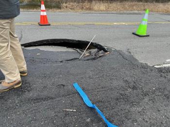 This sinkhole shut down a portion of state Route 127 (Middle Road) in Woolwich. Tommy Davis photo