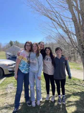 CTL seventh and eighth graders help restore lawns damaged by snow and winter plowing. Courtesy of CTL